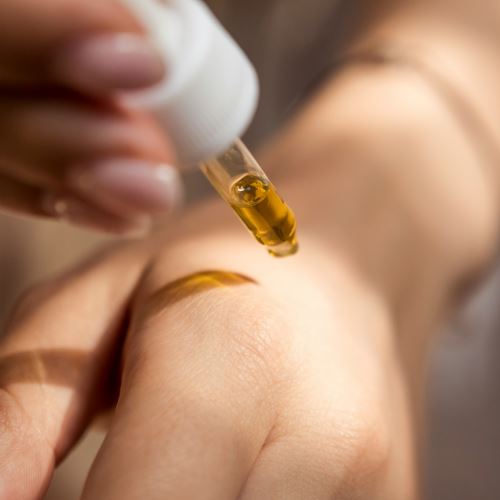 Huile protectrice dorée pour les bains de soleil