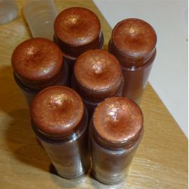 Rouge à lèvres/ fard à joues  rouge-doré parfumé